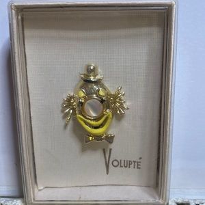 Volupte clown face brooch in gold, yellow, and mother of pearl